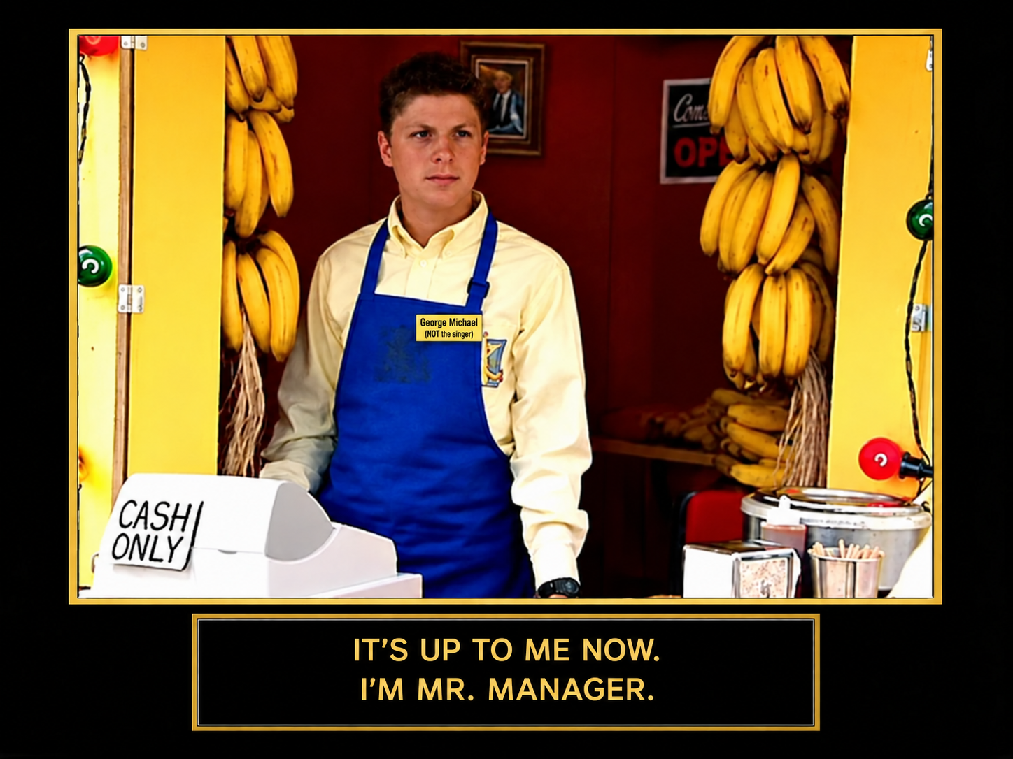 George Michael at the banana stand, wearing a George Michael (NOT the singer) name tag. Caption: It’s up to me now. I’m Mr. Manager.